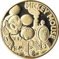 大井川鉄道のSLとミッキーマウスの金色メダル