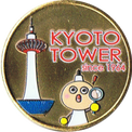 京都タワーとたわわちゃんの金色メダル