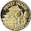 名古屋城とミッキーマウスの金色メダル